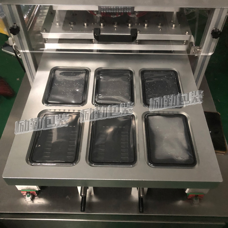 塑料盒气调封口机 食品盒封膜机 保鲜盒自动包装机 励勤包装图片